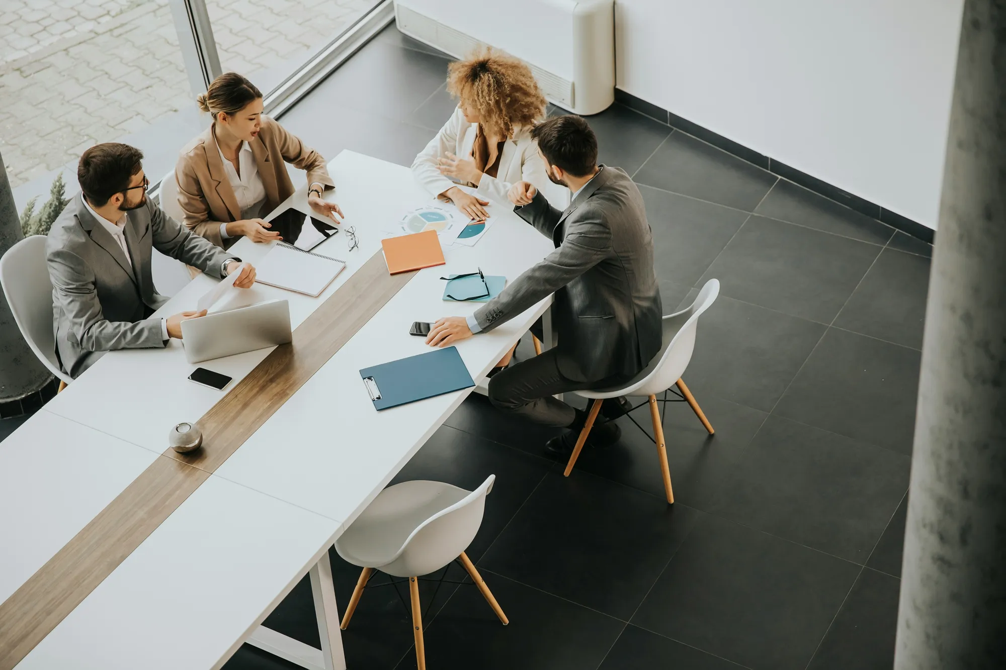 A firm's team meeting around a conference table